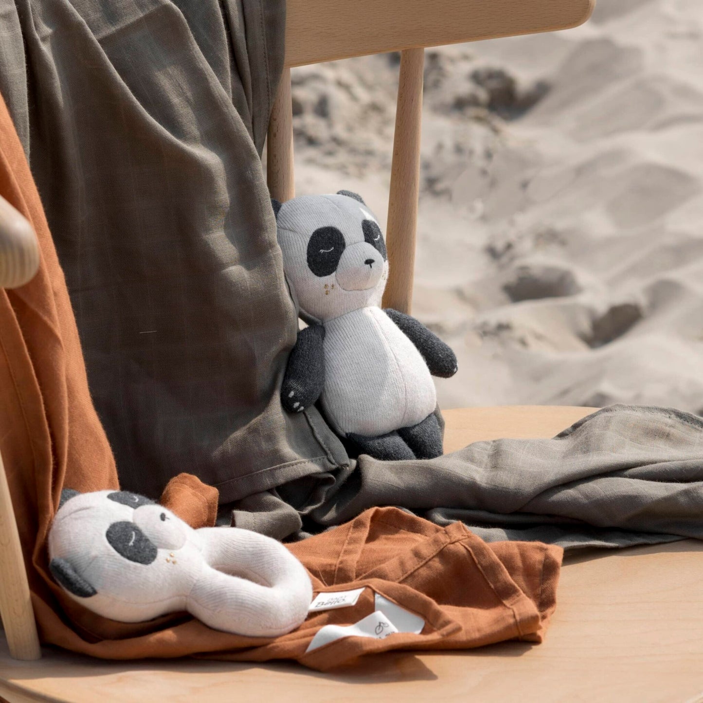 PLÜSCHTIER MIT GLOCKE - POLLY DER PANDA